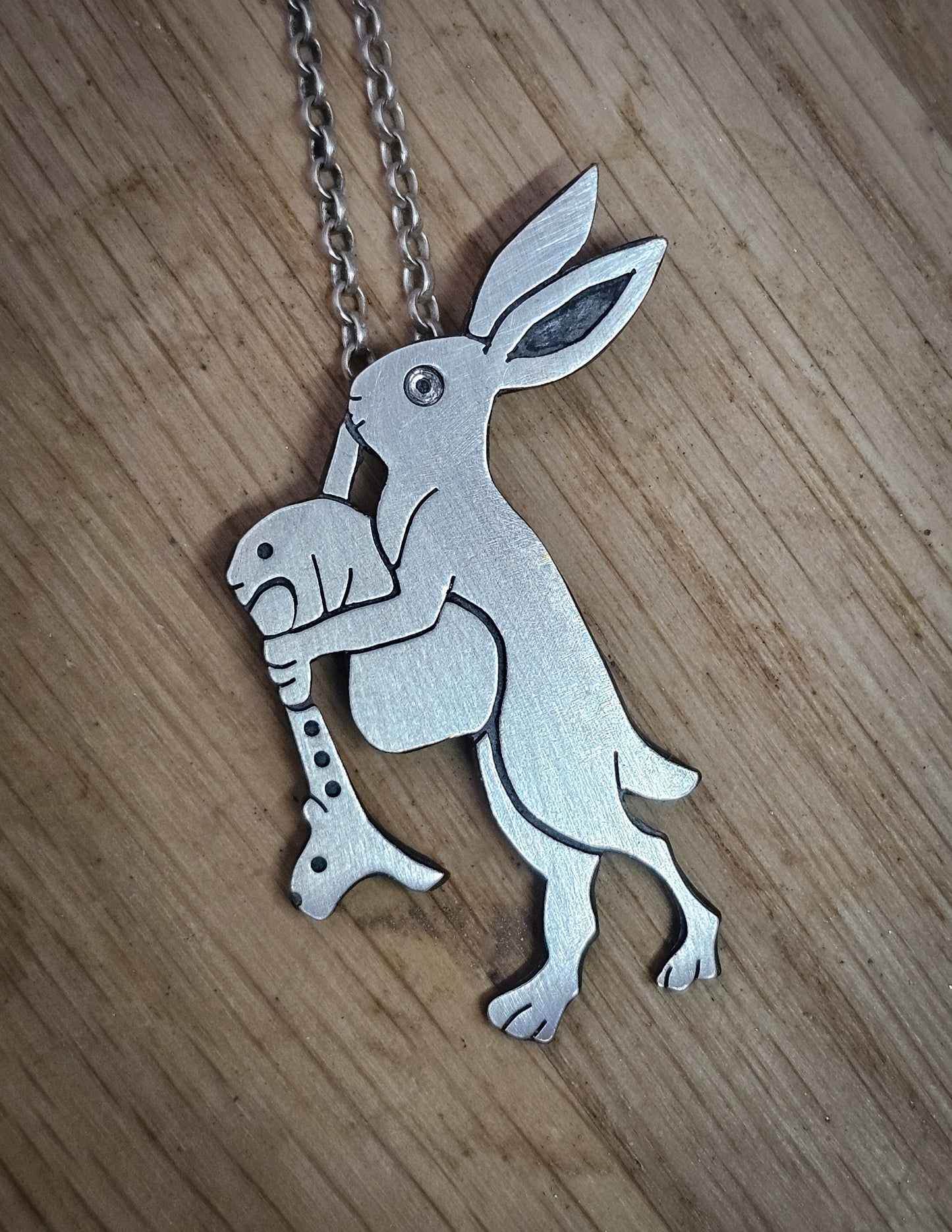 Marginalia pendant, rabbit playing bagpipes