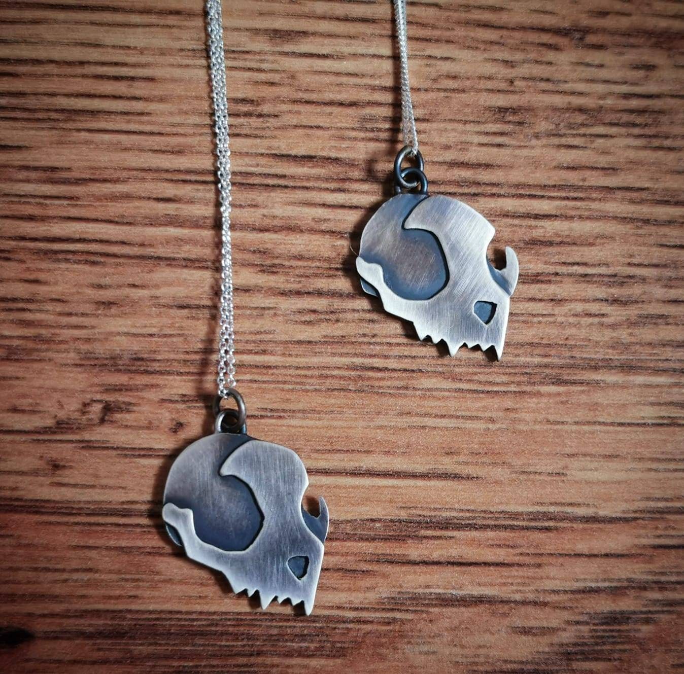 Handmade Sterling silver cat skull pendant.