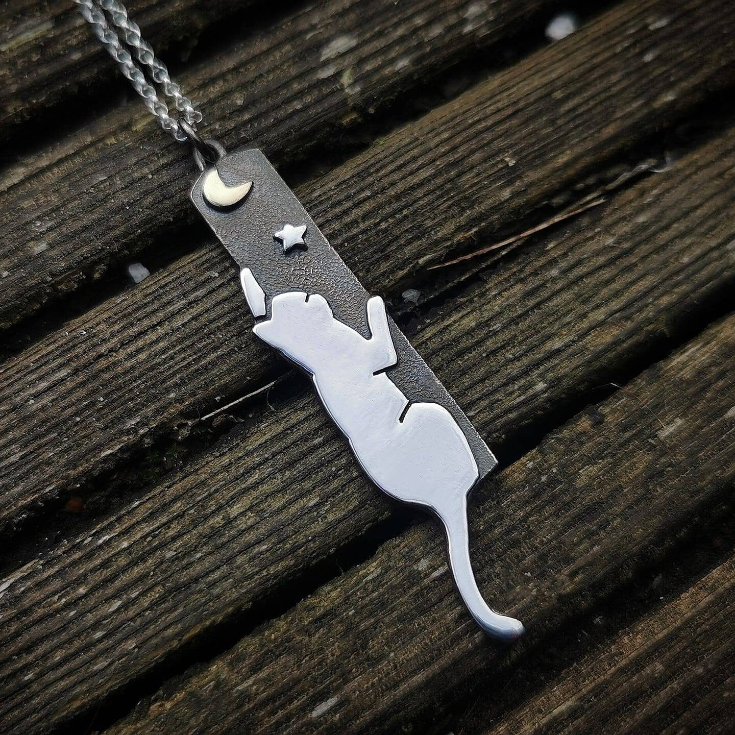 Handmade Sterling silver cat reaching to the moon pendant.