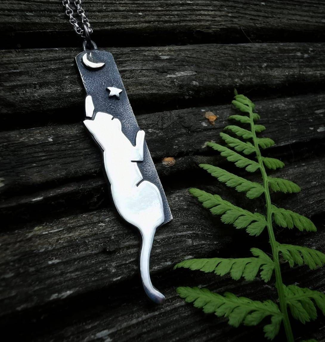 Handmade Sterling silver cat reaching to the moon pendant.